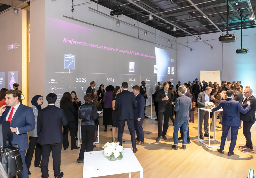 Wall of the event space onto which a retrospective of the Canadian climate institute's projects, created by Voilà, is projected.
